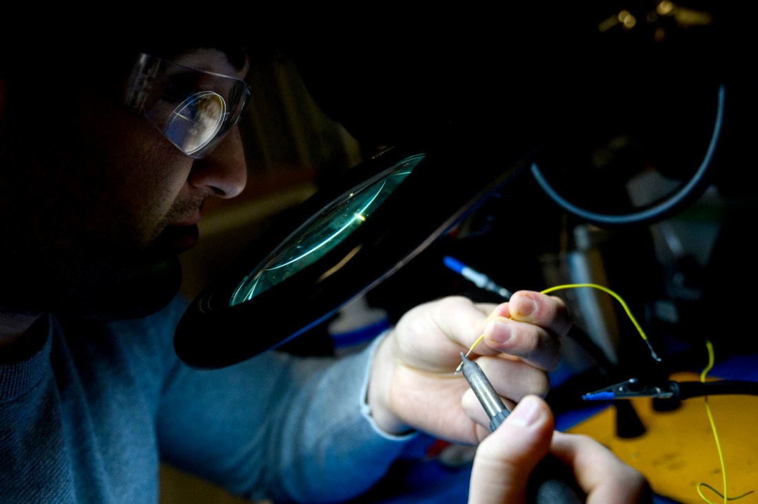 Nick Scaperdas soldering electrical wires together