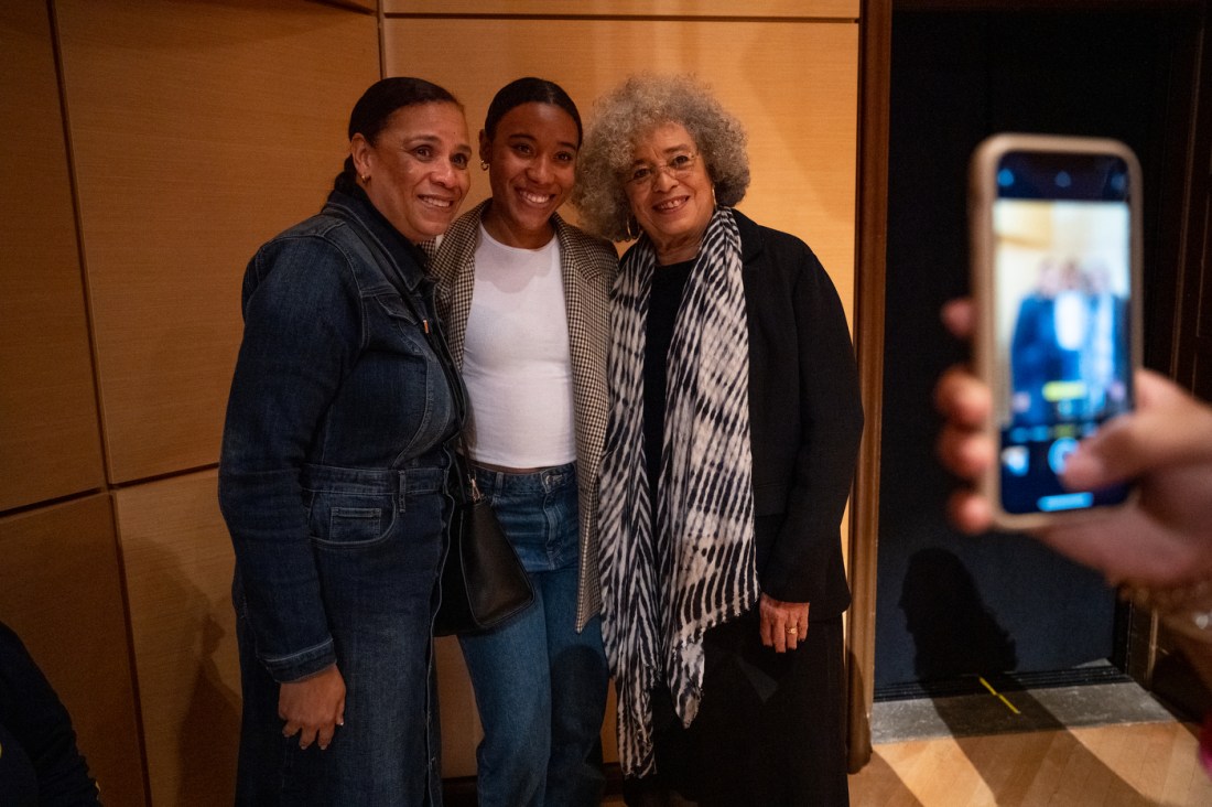 angela davis posing for a picture with two other people