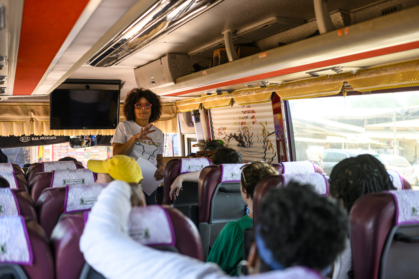 Dr. Vanessa Johnson speaking to people on a bus