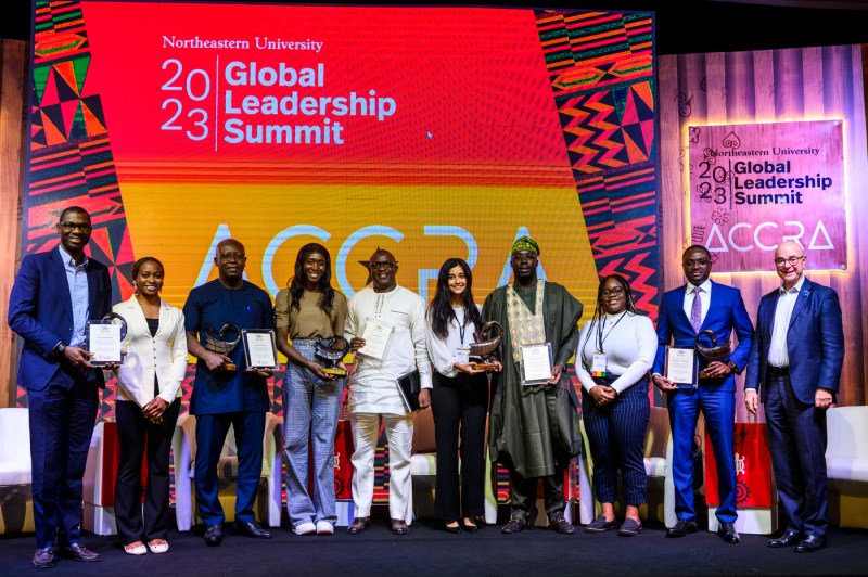 group of people posing on stage at Global Leadership Summit in Ghana