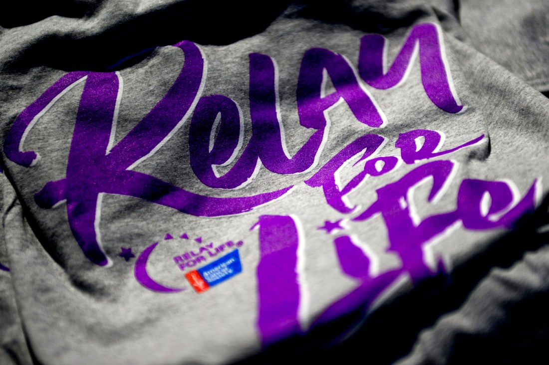 grey shirt with 'relay for life' written in purple on it