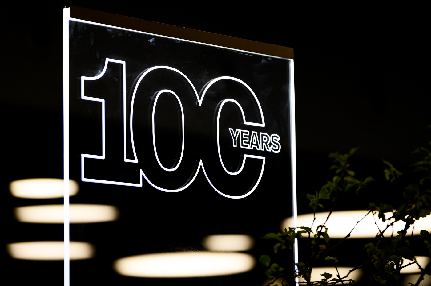 neon sign that says '100 YEARS'