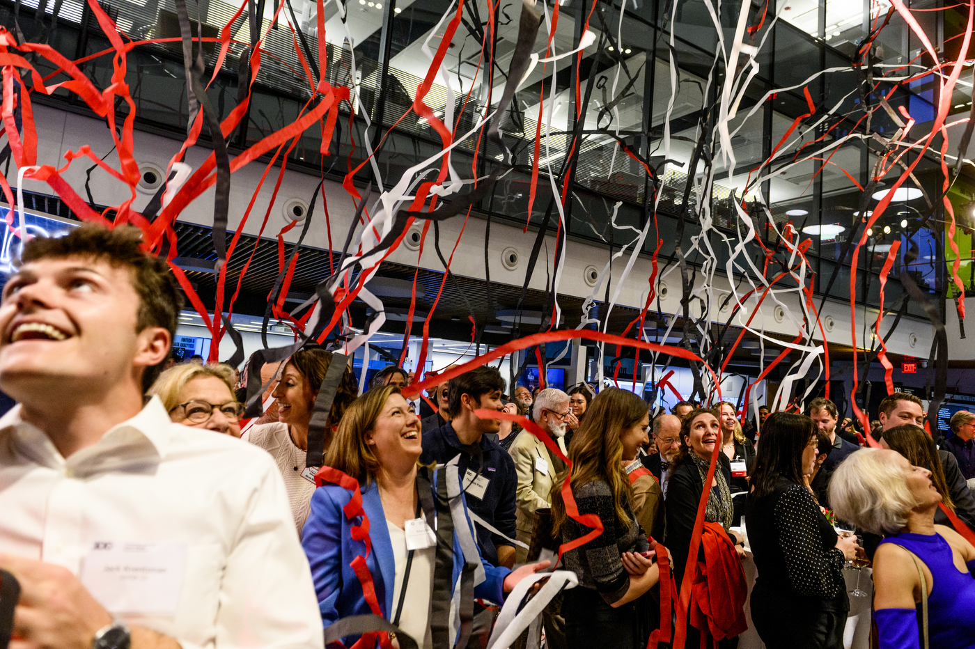 streamers falling onto audience at D'Amore McKim's 100th Anniversary event