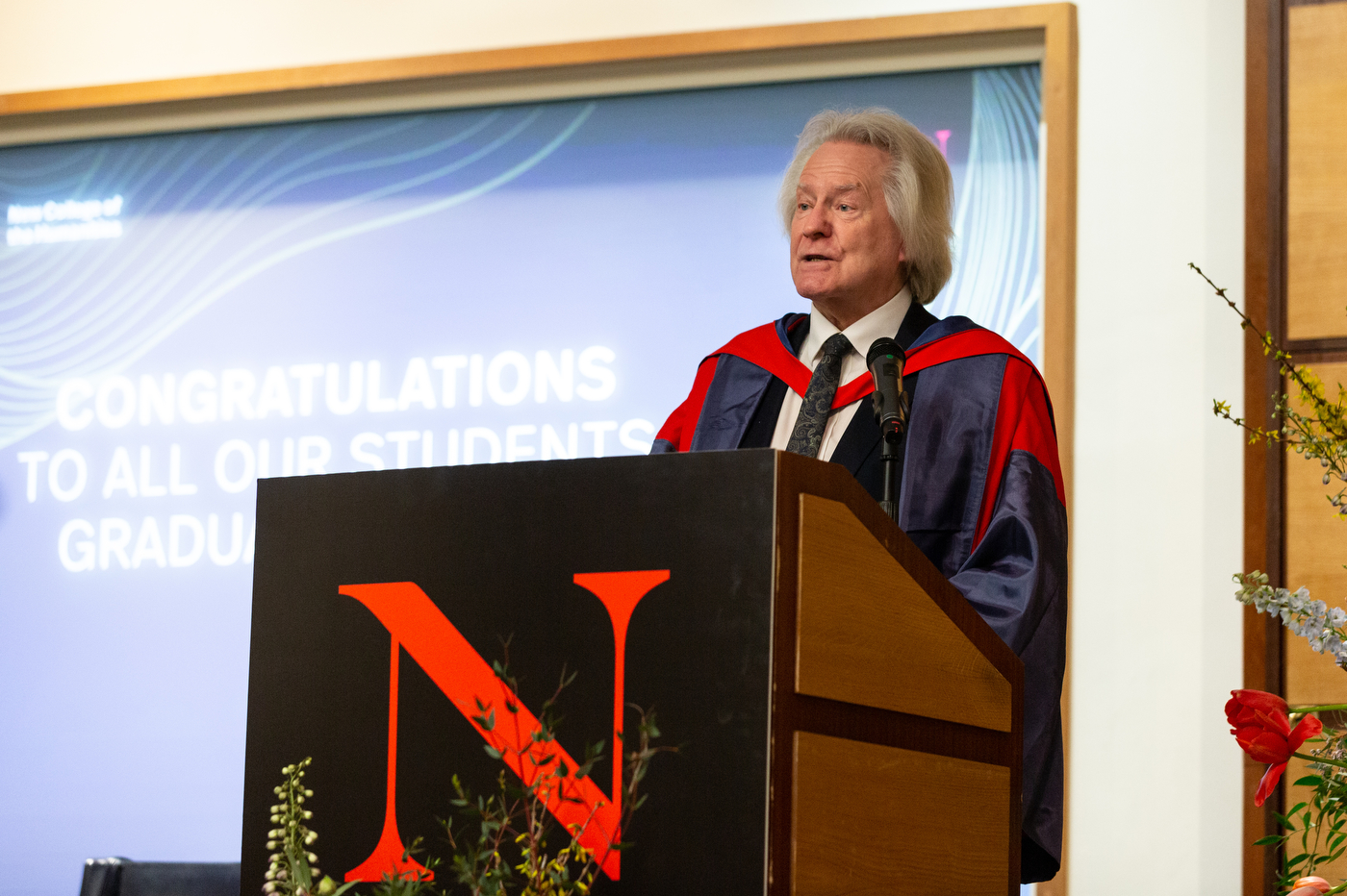 faculty member speaking at northeastern university london graduation