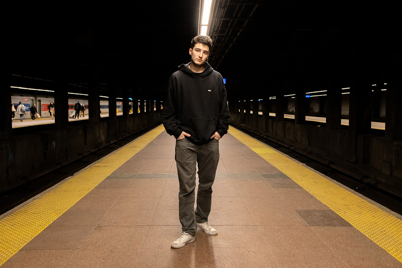 Jonathan Klopp posing for photo in a subway station