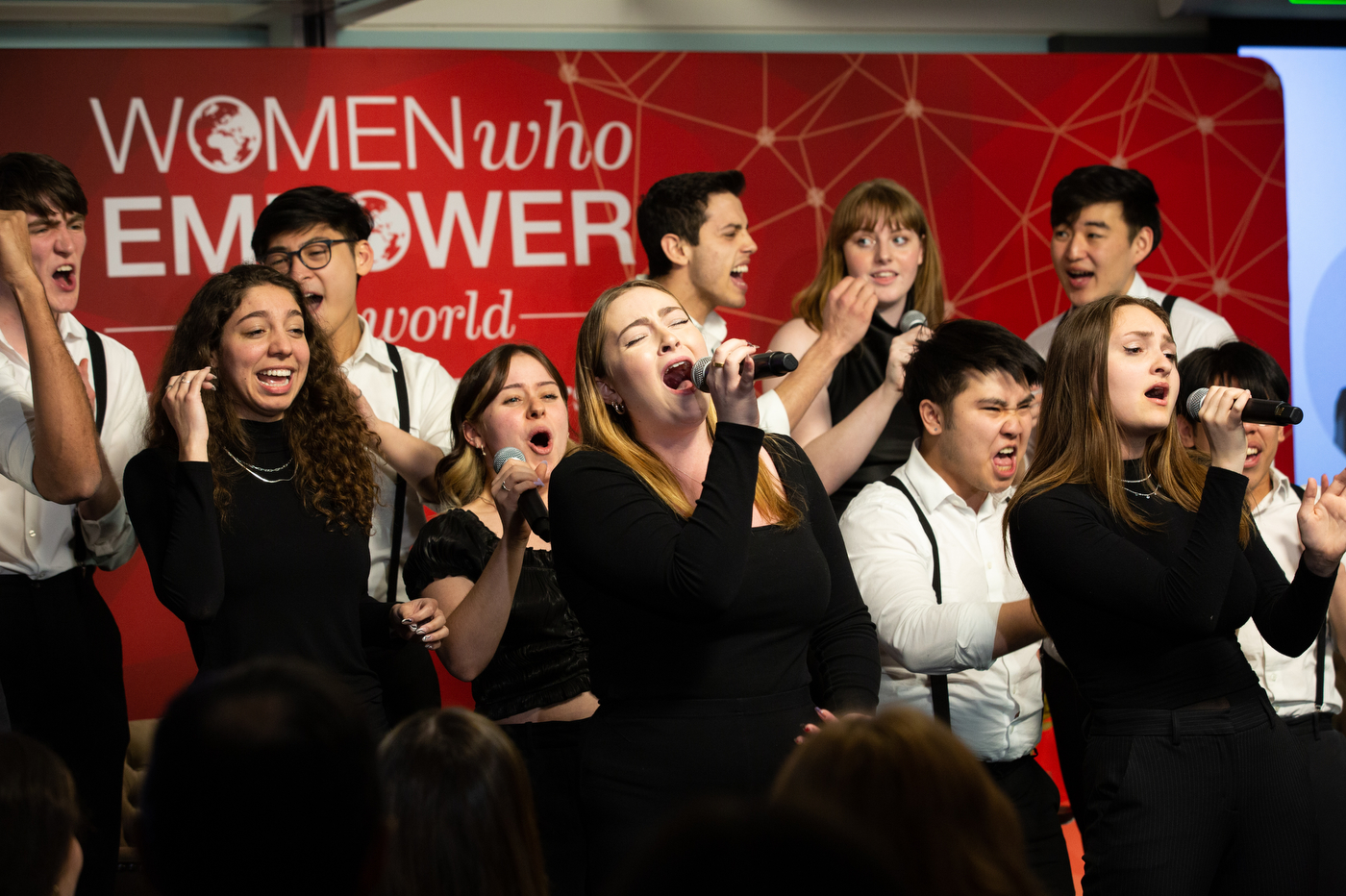 nor'easters a capella group singing at women who empower event