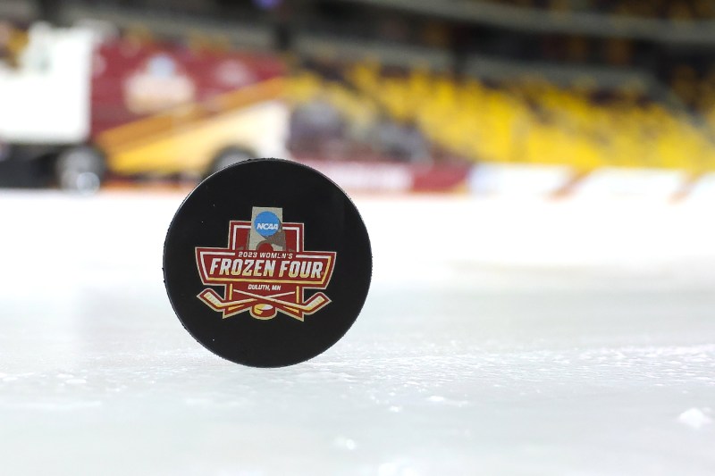 frozen four hockey puck on the ice
