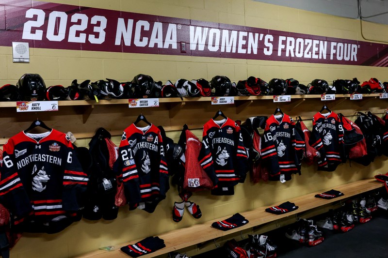 northeastern hockey jerseys hanging in the changing room
