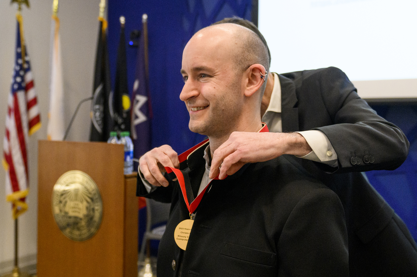 Christon Wilson accepting medal as Robert D. Klein Lecturer