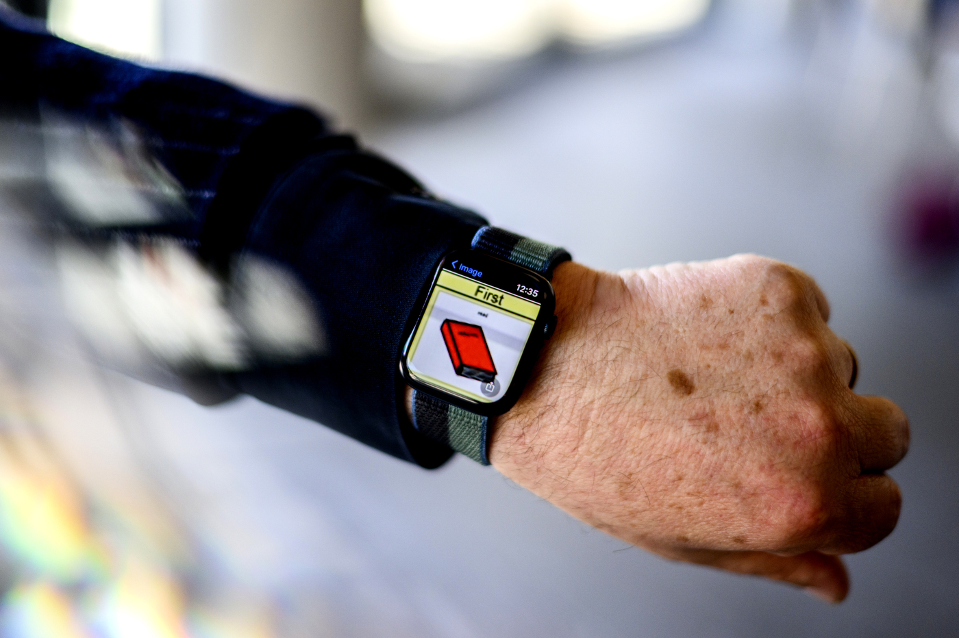 Ralf Schlosser wearing smartwatch with assistive communication technology