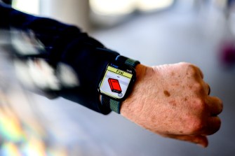 Ralf Schlosser wearing smartwatch with assistive communication technology