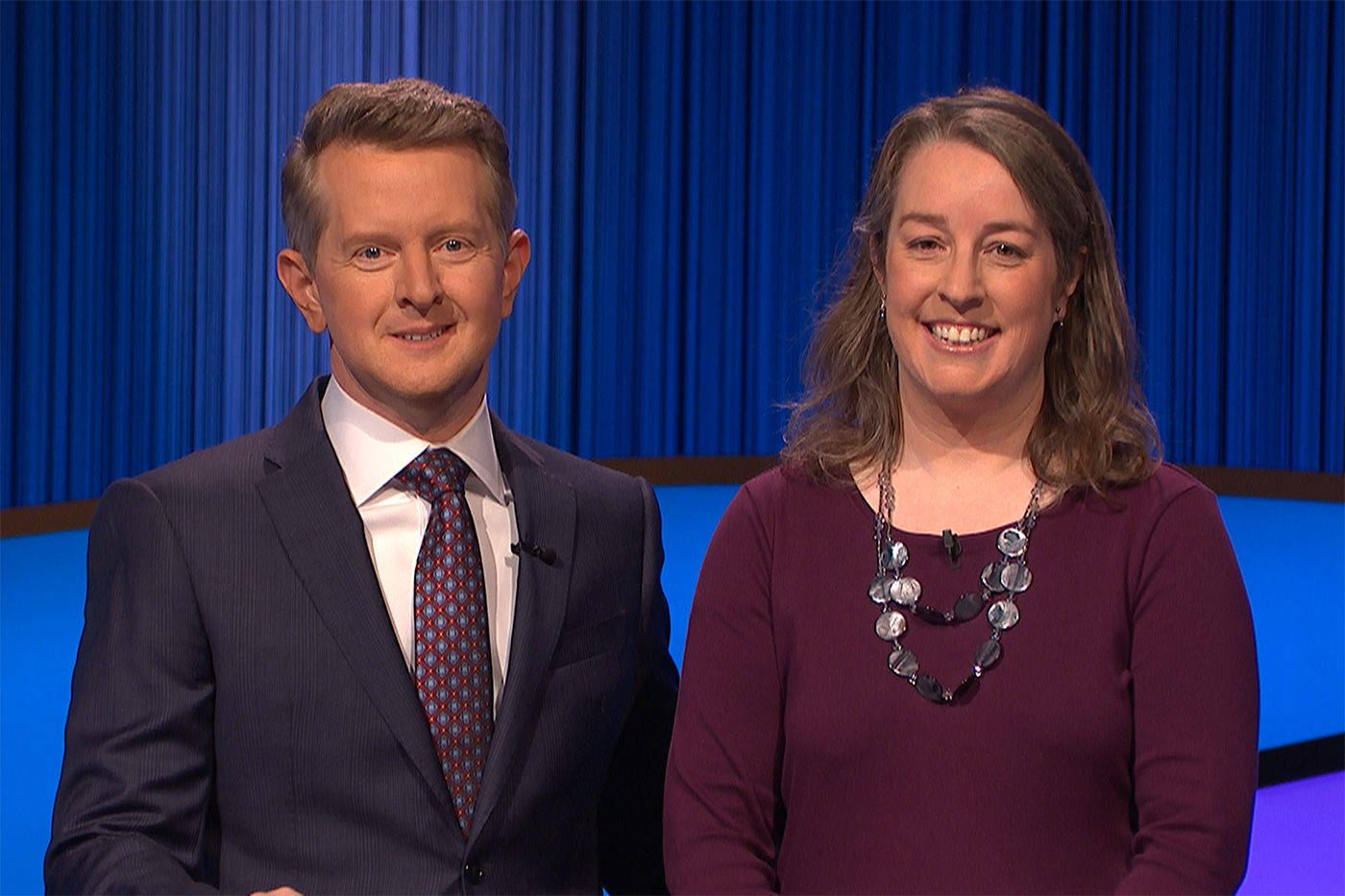 Rebecca Bailey standing next to Ken Jennings on set of Jeopardy!