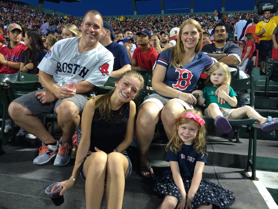 Victoria McGrath and the Plourde family at a Boston Red Sox game in Fenway Park