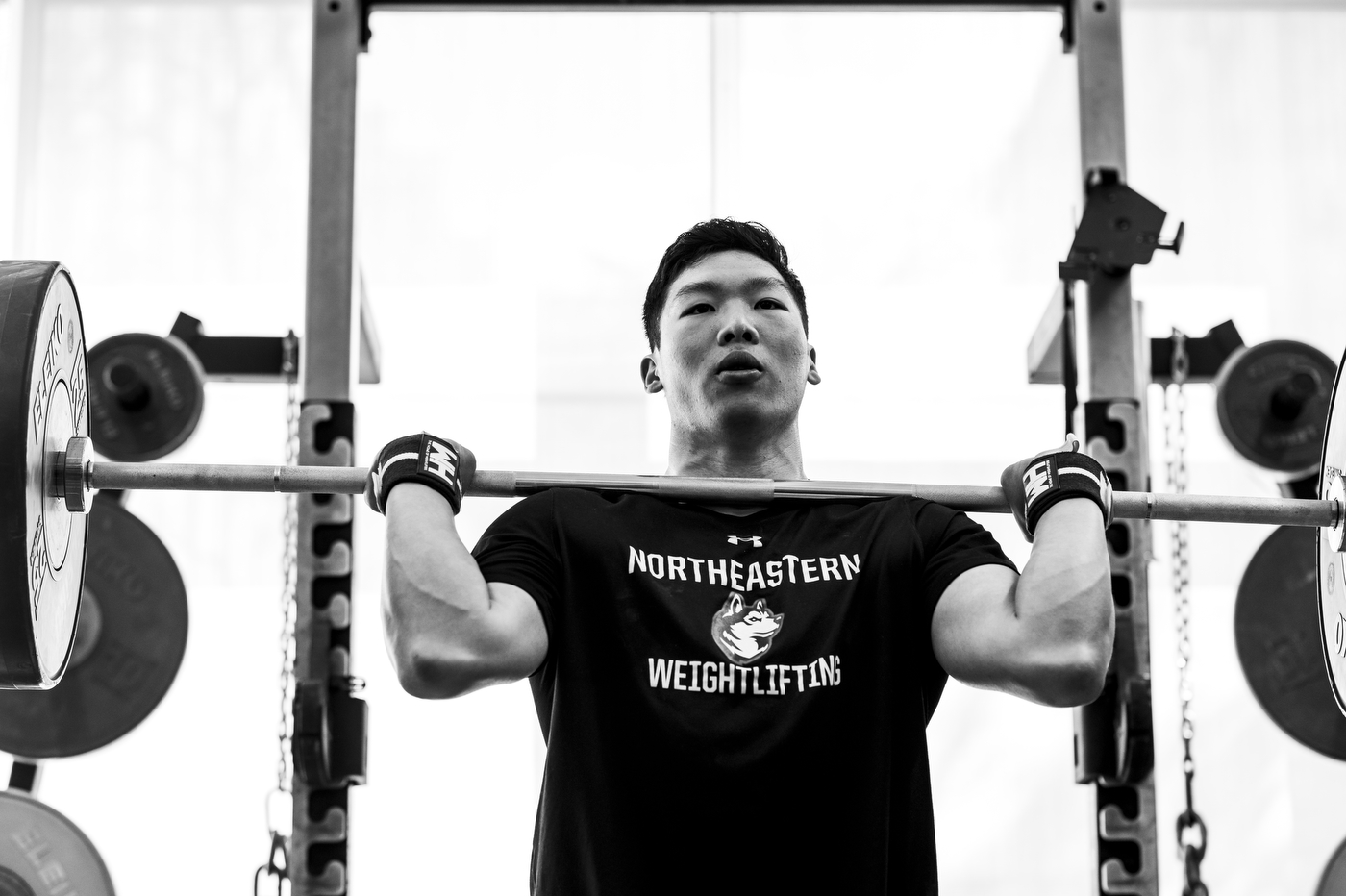 Matt Tung lifting weighted barbell