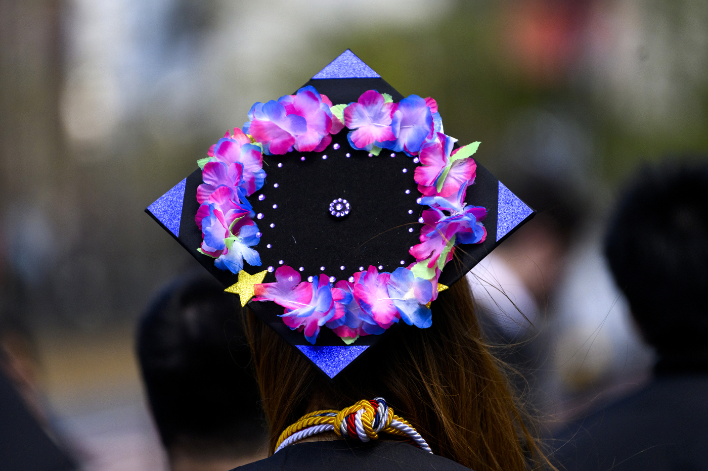 A graduate showing off her mortarboard.