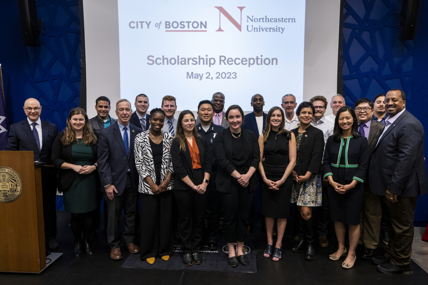 group of Boston city employees and Northeastern leadership posing for a photo