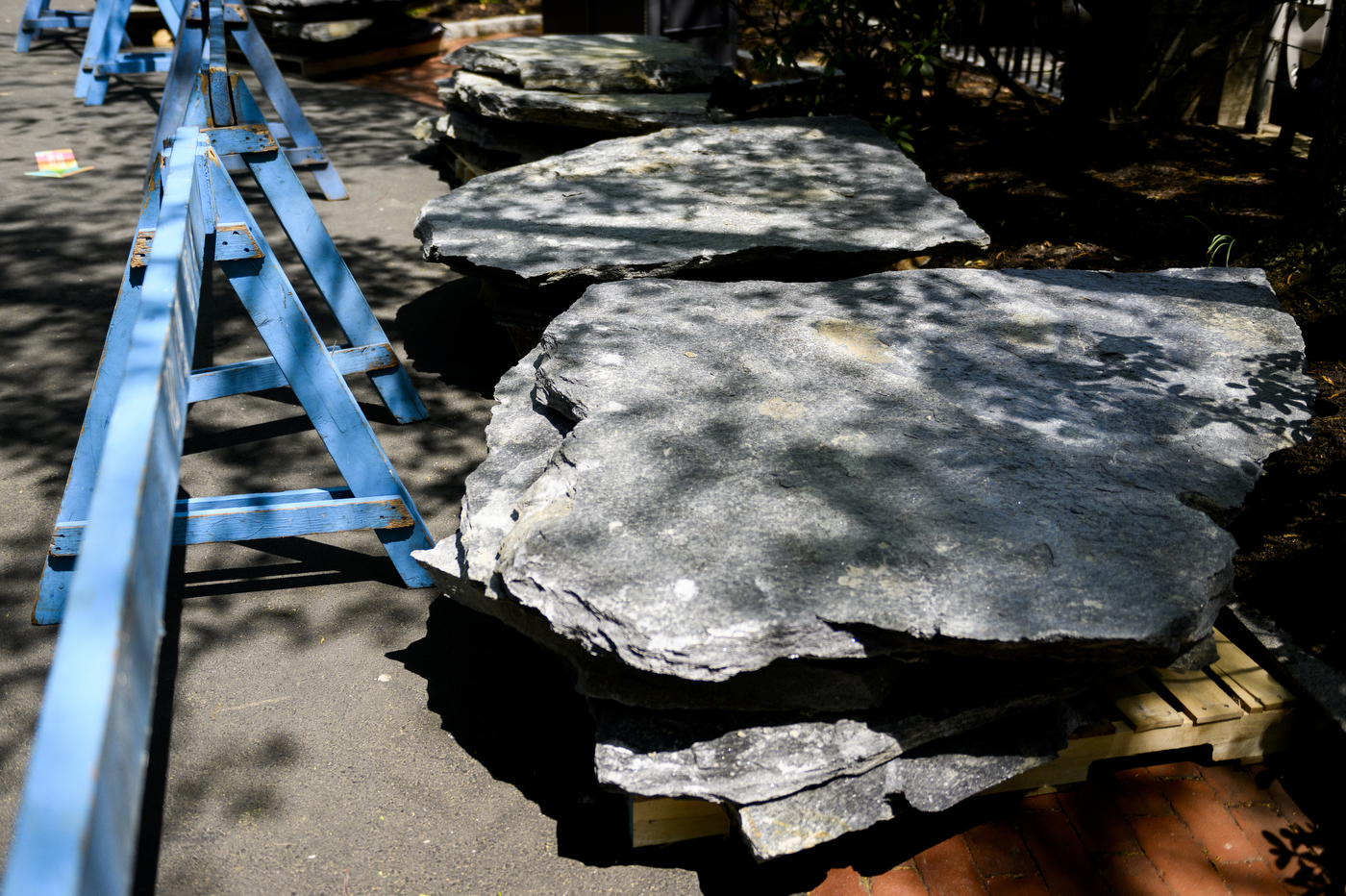 large stones positioned near koi pond for renovations