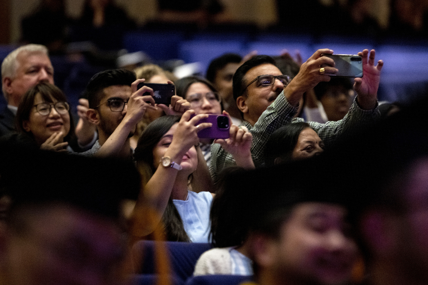 audience members taking pictures with their phones. atVancouver convocation