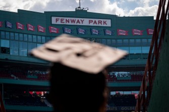 graduate wearing a cap at fenway park