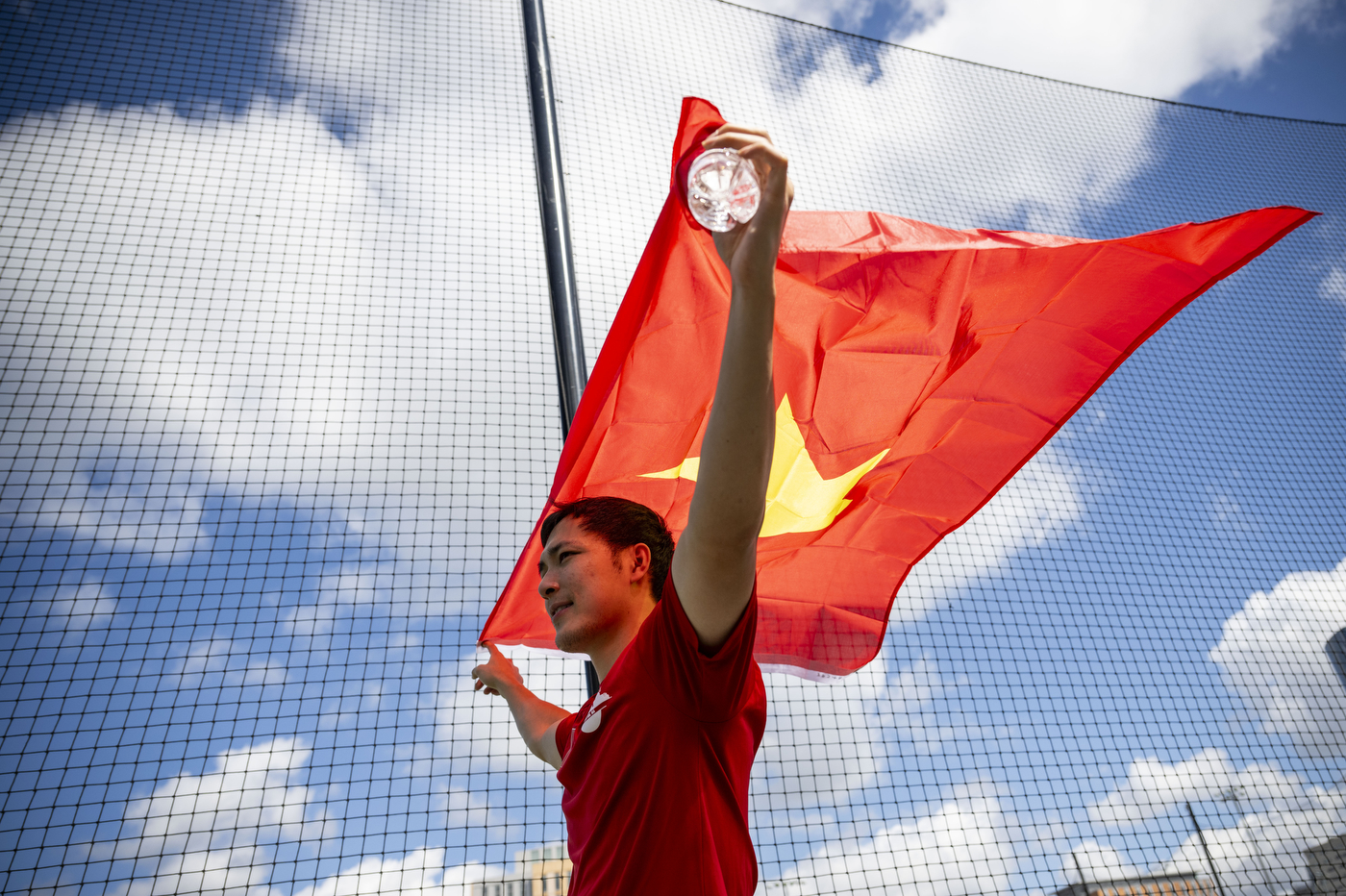 A person holds a flag.