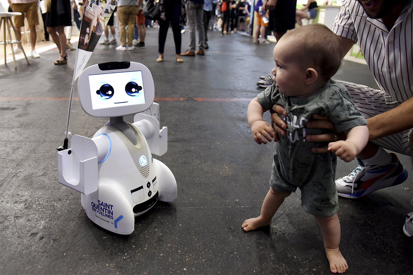 toddler meeting a robot