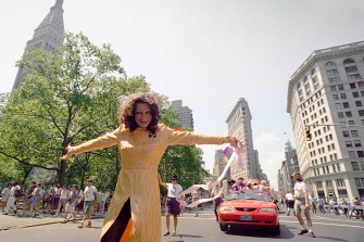 Sylvia Rivera posing on a street next to New York's Union Square Park