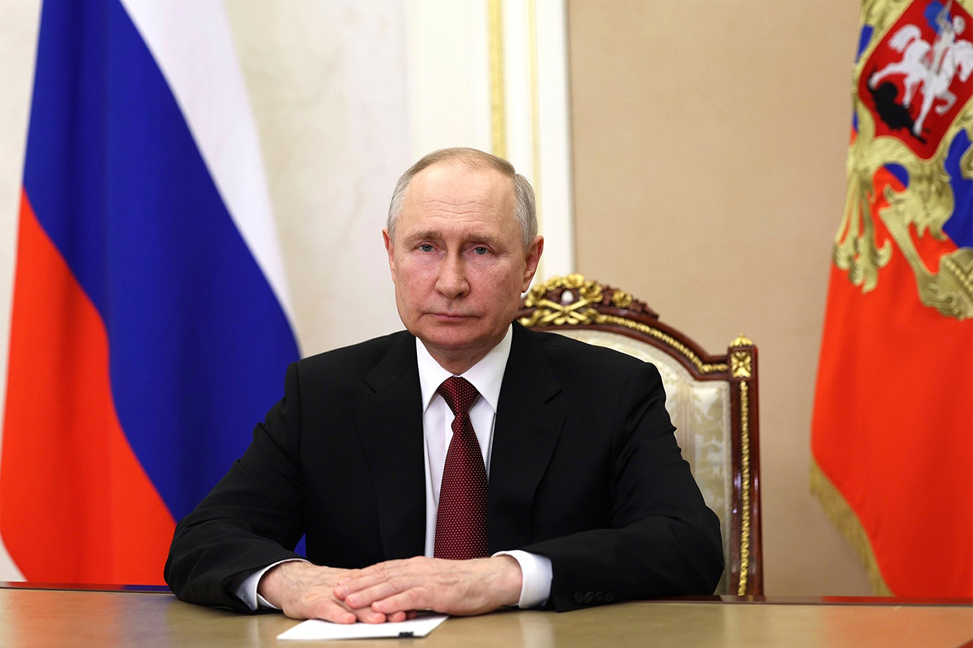 President Valdimir PUtin sitting at a desk