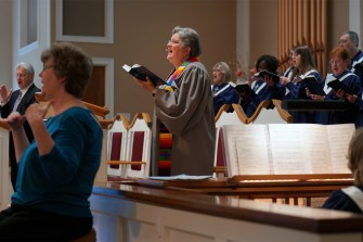 A woman pastor speaks at Southern Baptist Church.