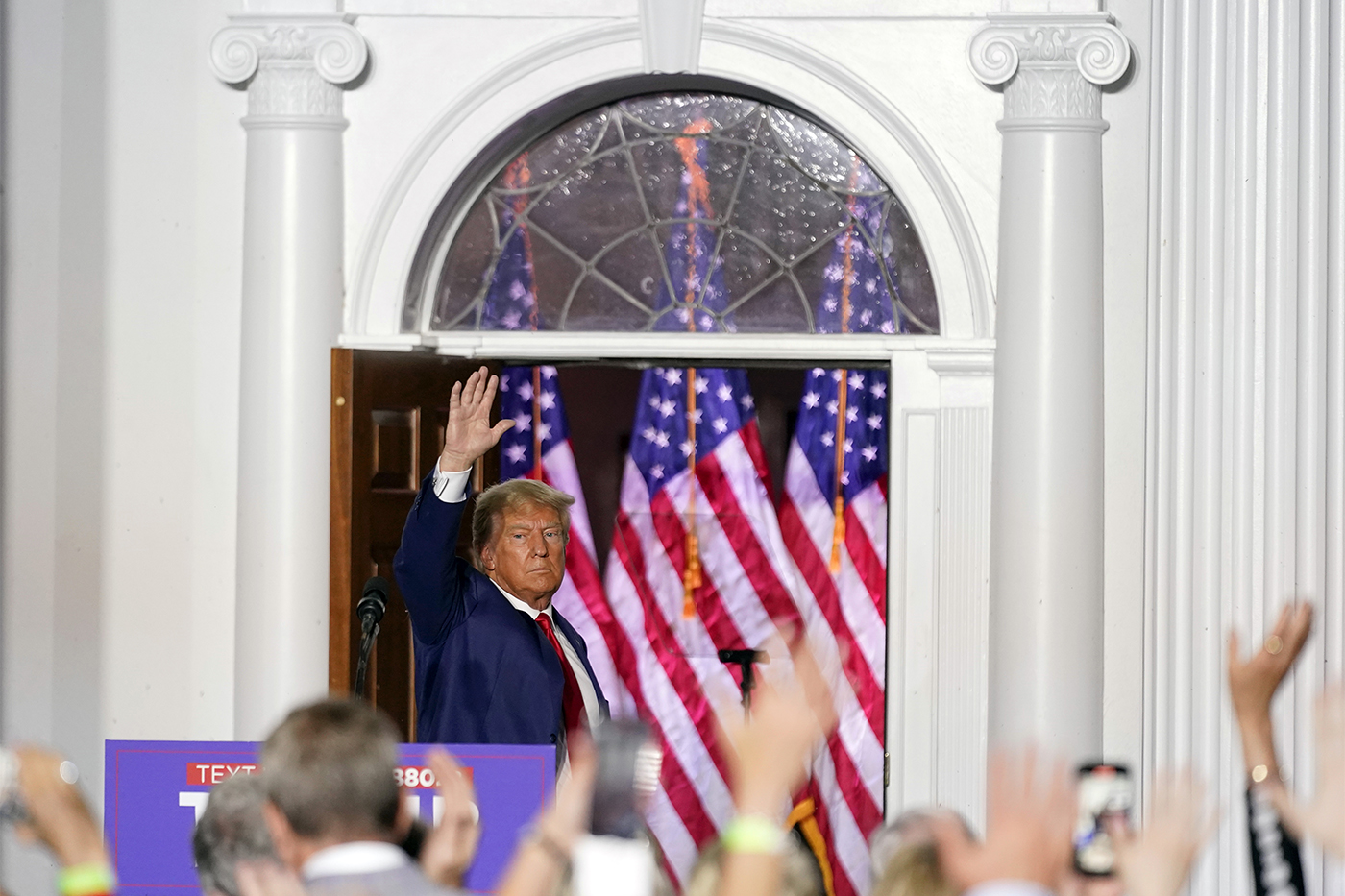 Donald Trump waving to a crowd of supporters