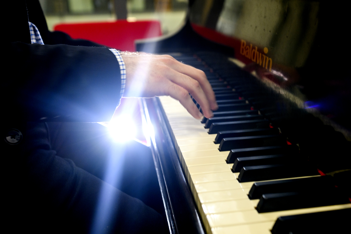 Closeup of Andrew Andraos's hands on piano keys
