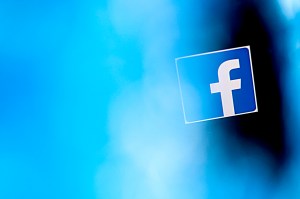 facebook logo on blue and black background