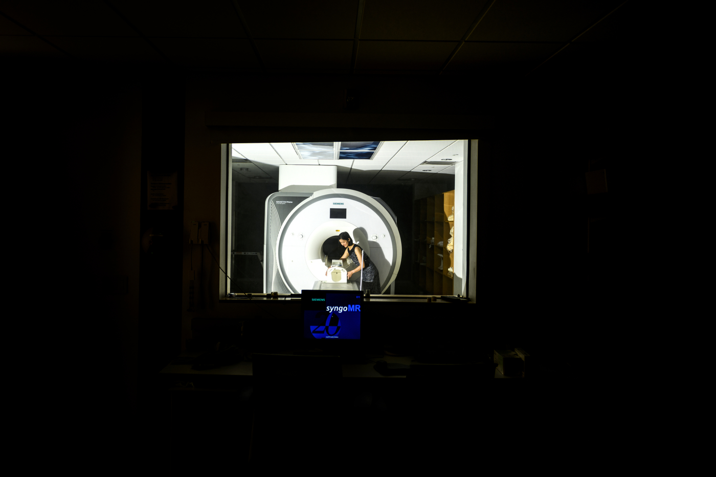 Zhenghan Qi working on research in an MRI lab
