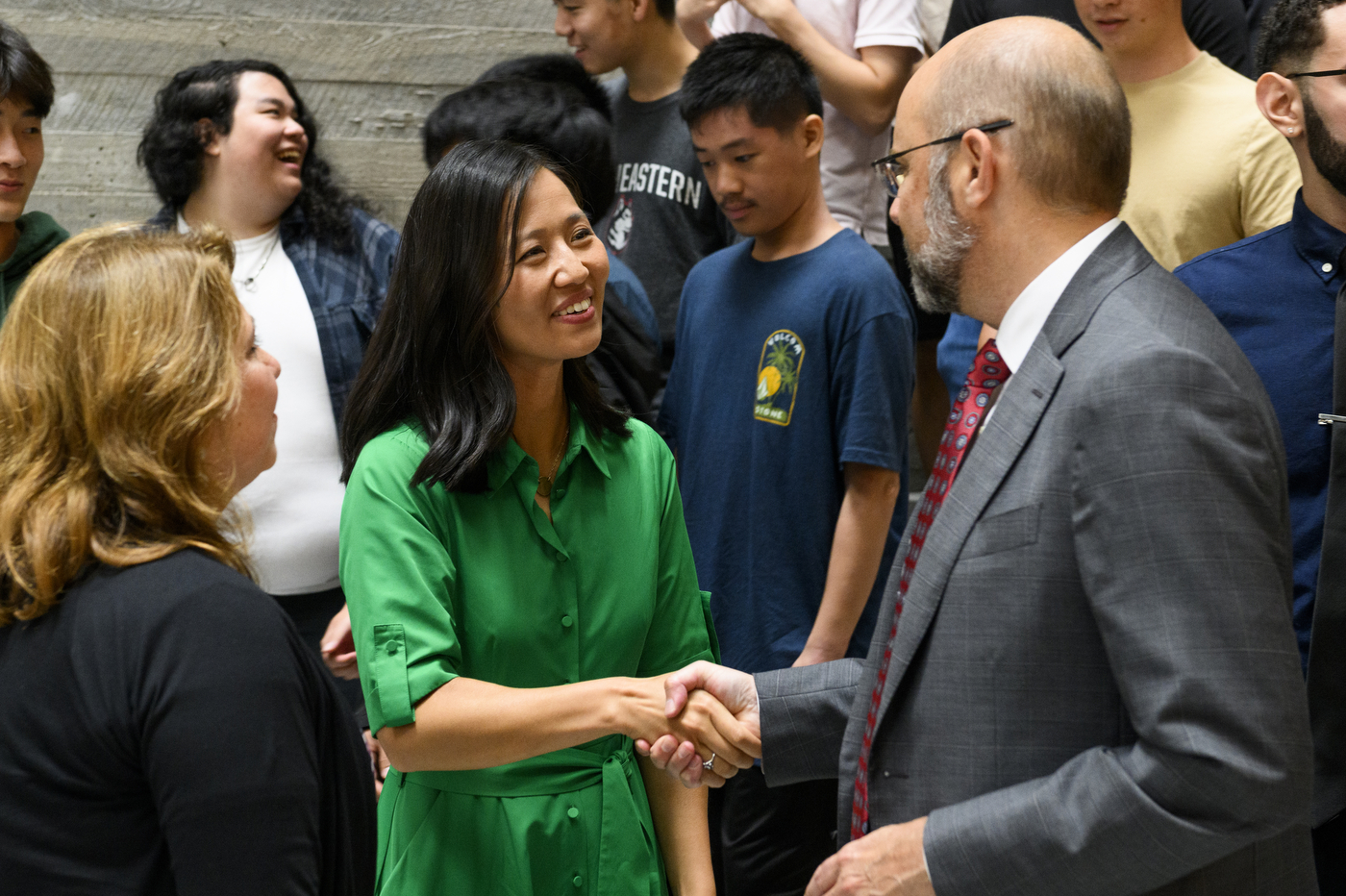 Mayor Michelle Wu shaking someone's hand