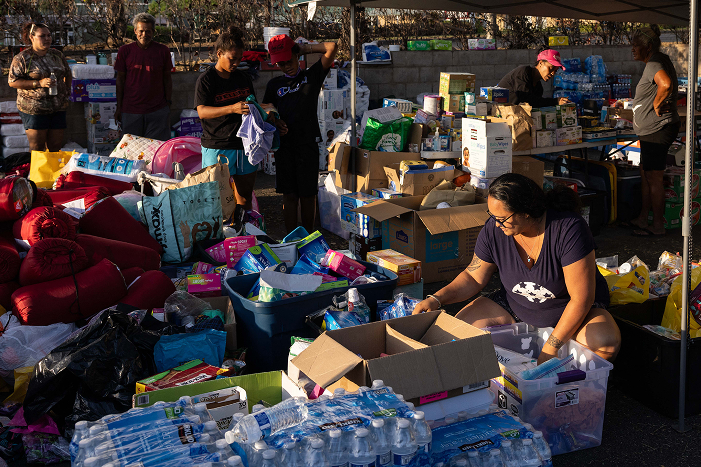 volunteers sorting donations in Lahaina, Maui