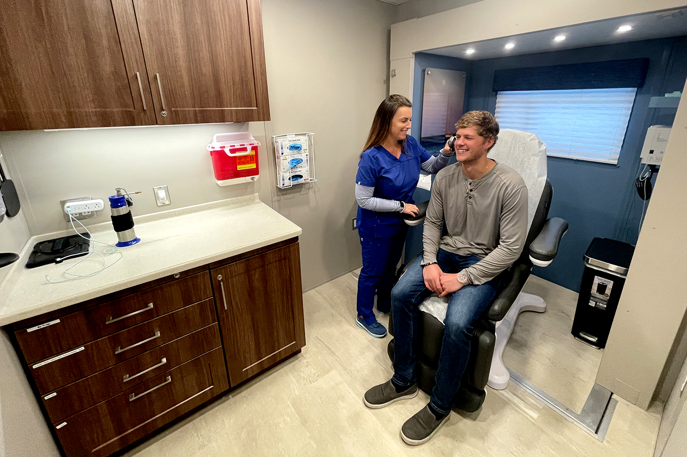 nurse and patient in an OnSpot Dermatology truck