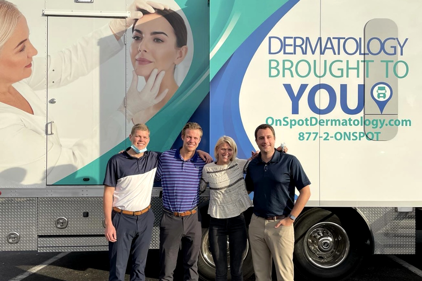 Don Hunt, Dustin Hunt, Cassandra Hunt and Tom Dempsey, OnSpot's general manager, pose for a photo in front of one of the mobile clinics. Courtesy photo