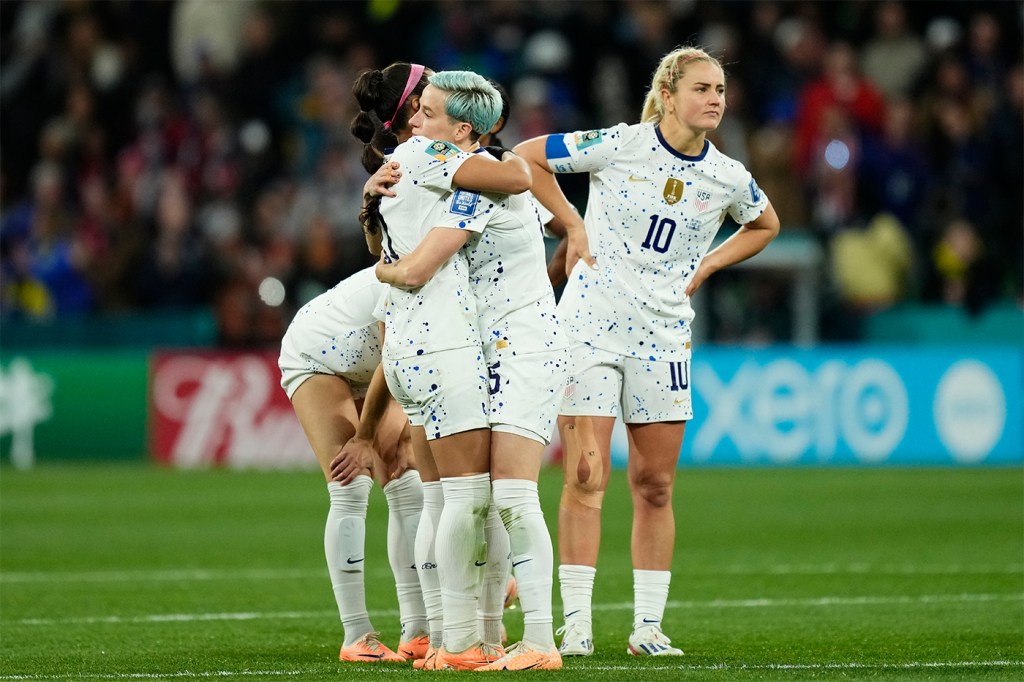 Sophia Smith, Megan Rapinoe, and Lindsey Horan on the field after losing the 2023 Women's World Cup