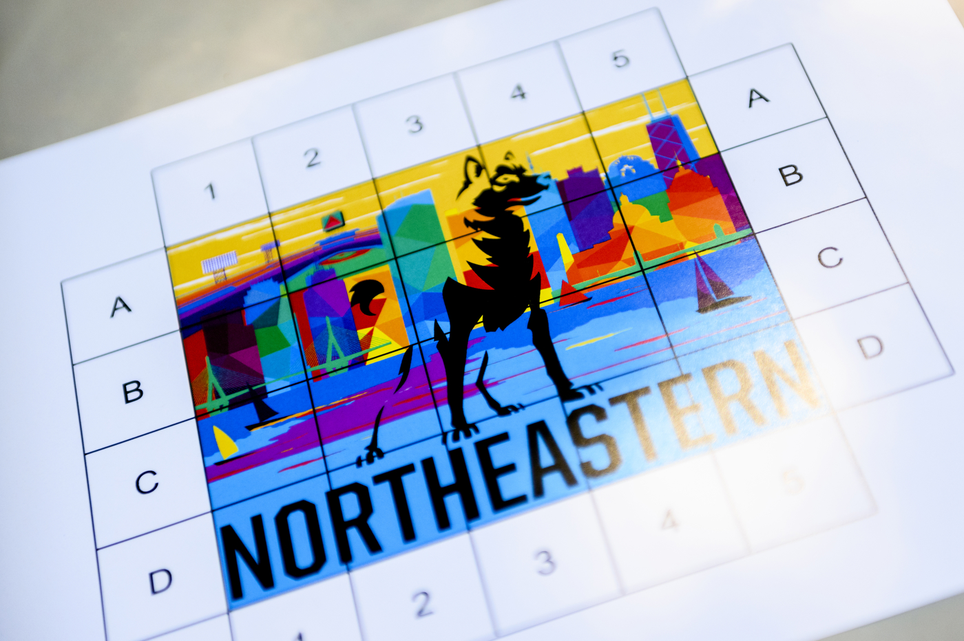 A multi-colored board with various letters and black text: "Northeastern".