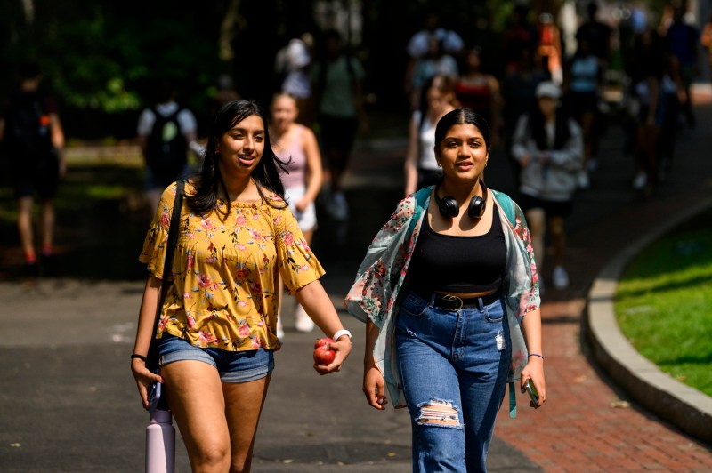 two students walk on campus