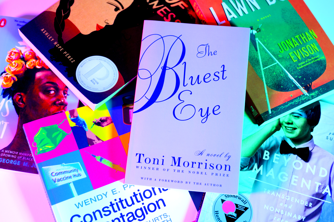 stack of books with a book called The Bluest Eye on top