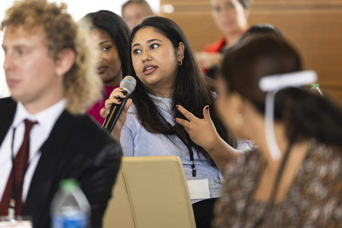 An audience member asks a question into a microphone at the Northeastern University Social Media Summit.
