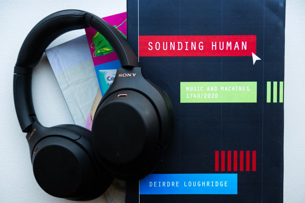 Headphones on top of Deirdre Loughridge's new book Sounding Human.
