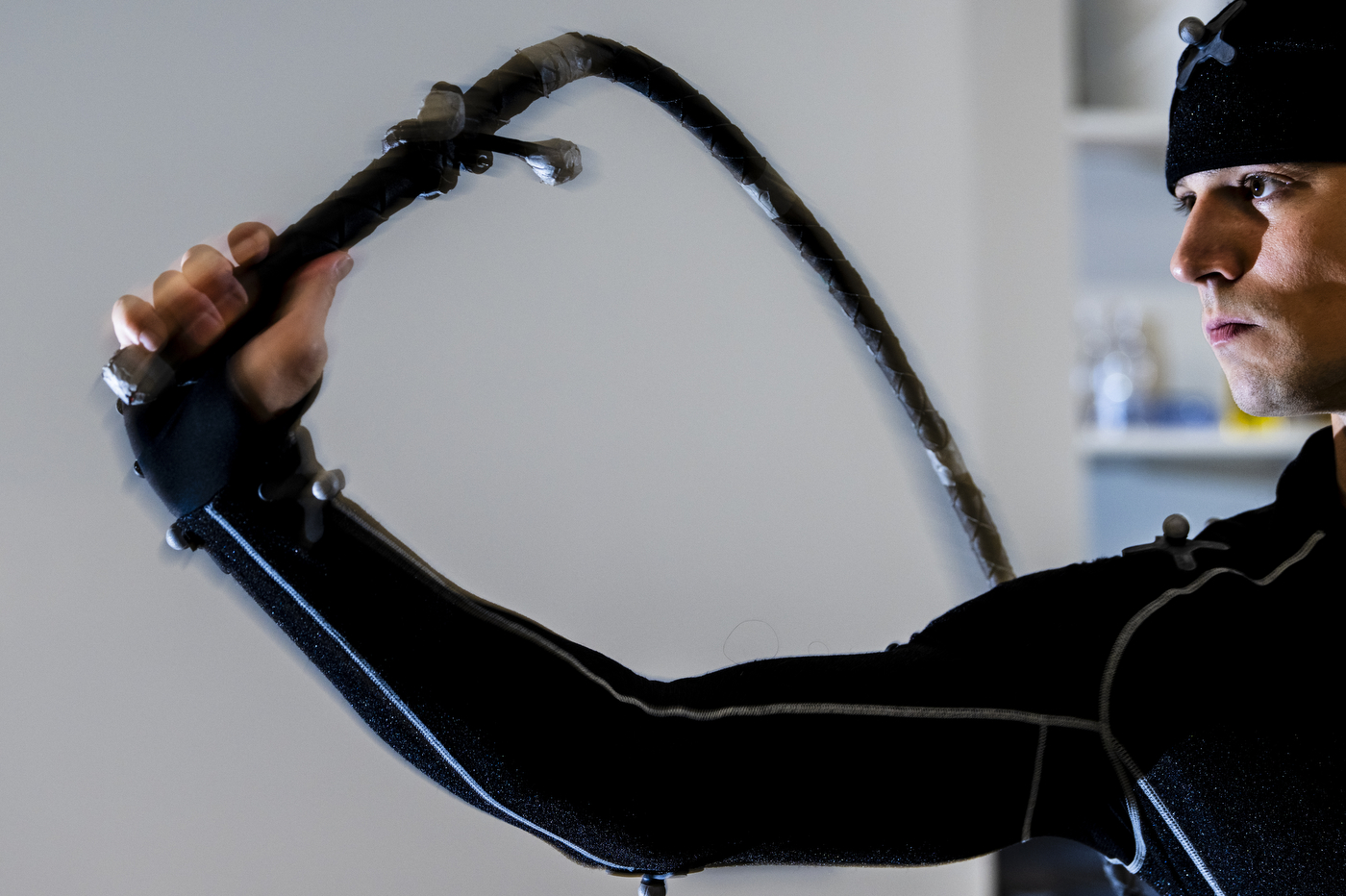 A person preforms human motor control with a whip.