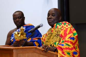 His Royal Majesty Osagyefuo Amoatia Ofori Panin of Ghana speaks at a podium.