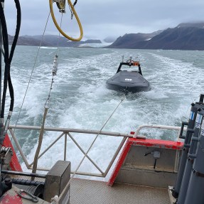 Expedition boat traveling to the Northernmost Arctic field station.