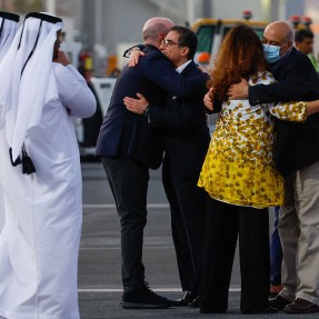 Siamak Namazi and Morad Tahbaz are embraced upon their arrival in Doha.