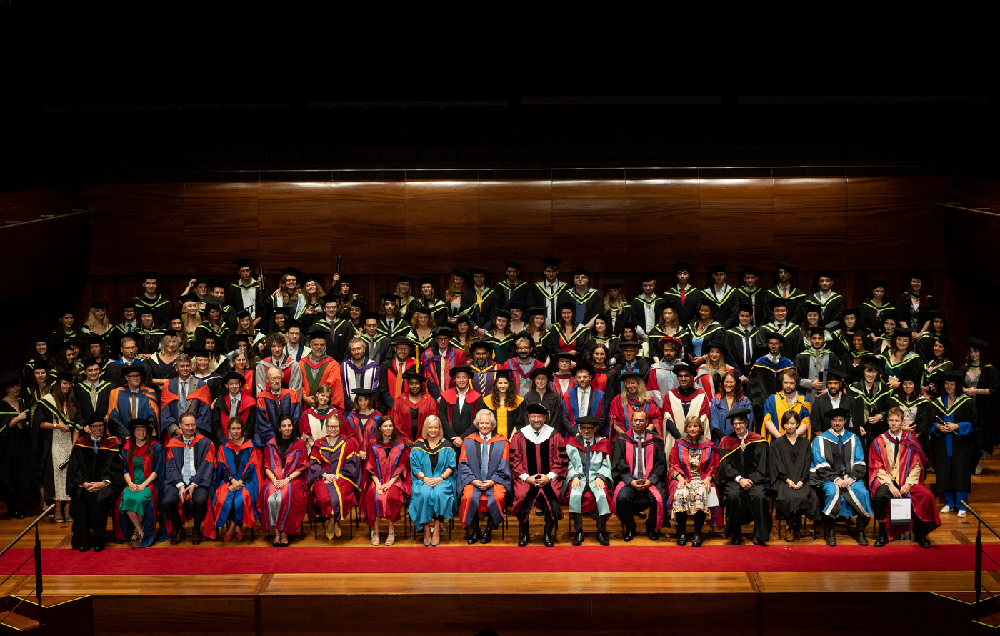A large crowd poses for a picture at Northeastern London's commencement ceremony.