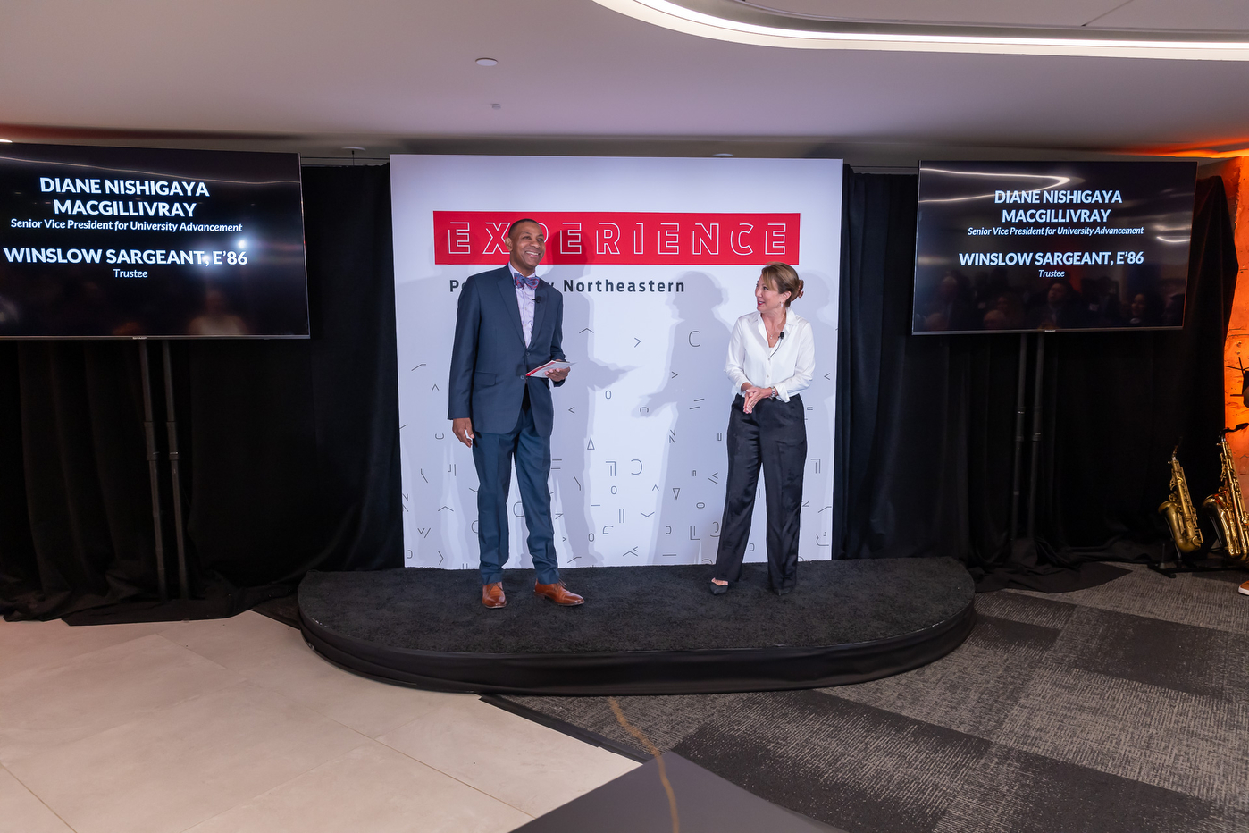 Diane Nishigaya Macgillivray and Winslow Sargeant speaking at the Experience Powered by Northeastern campaign stop in Arlington.