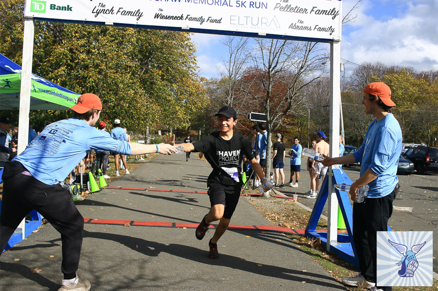 A runner crossing the finish line at the Ryan Shaw Memorial 5K.