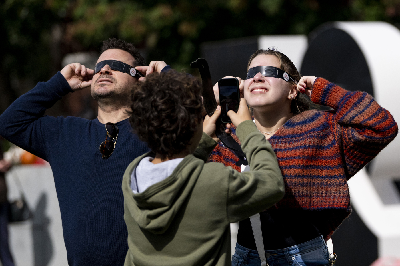 People with solar eclipse sunglasses at at Family and Friends weekend.